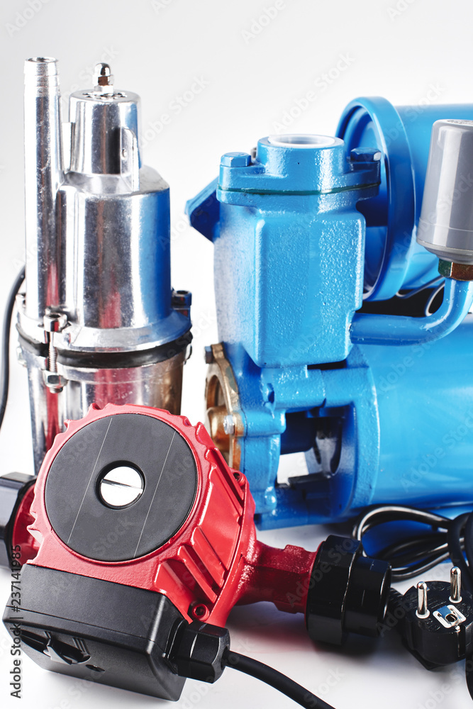 Various pumping equipment for heating and water supply on a white background. Various pumping equipment for heating and water supply on a white background.