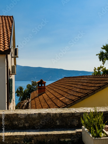 view of the Adriatic Sea tile roofs in cotor montenegro photo