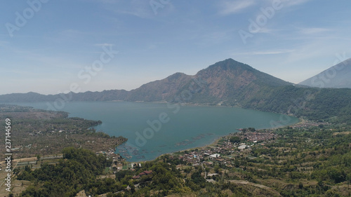 Aerial view crater lake and volcano Batur mountain landscape with volcanoes, lake with sky and clouds Bali, Indonesia. Travel concept.