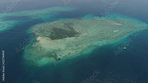 seascape aerial view coral reef, atoll with turquoise water in sea.Tropical atoll, coral reef in ocean waters. Travel concept.