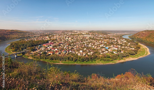 Scenic autumn landscape panorama of Ukrainian town Zalishchyky and Dniester River. Ternopil region, Ukraine