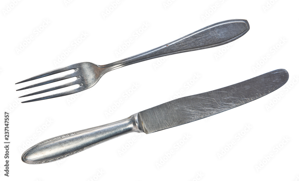 Top view of old silver fork and knife isolated on a white background Top view of old silver fork and knife isolated on a white background