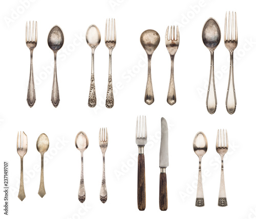 Vintage spoon, fork and knife isolated on a white background. Retro silverware.