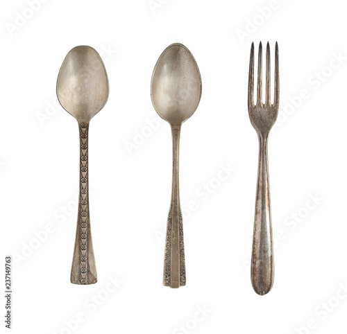 Vintage spoons and fork isolated on a white background. Retro silverware.