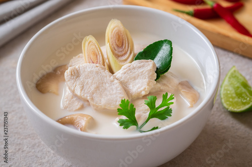 Chicken with coconut milk soup in white bowl, Thai food (Tom Kha Kai).