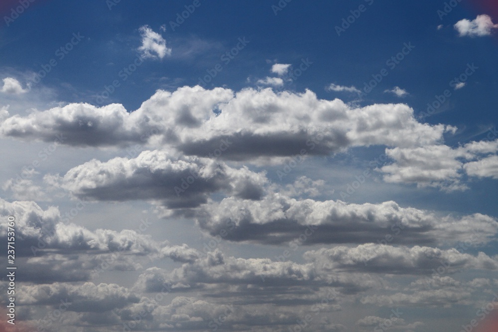 marvellous colorful cumulus partially cloudy sky for using in design as background.