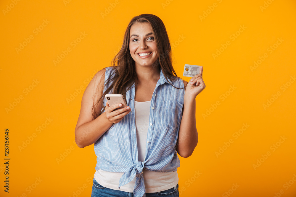 Happy young overweight woman standing isolated Happy young overweight woman standing isolated