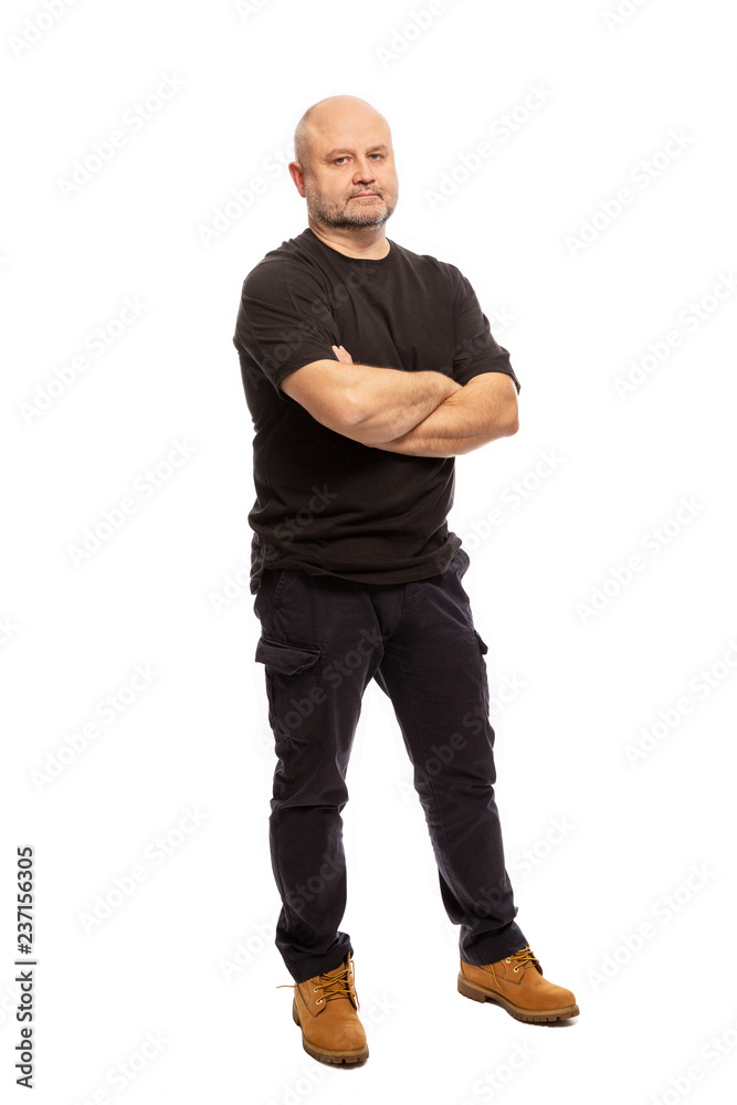 Adult bald man is standing, portrait on white background Adult bald man is standing, portrait on white background