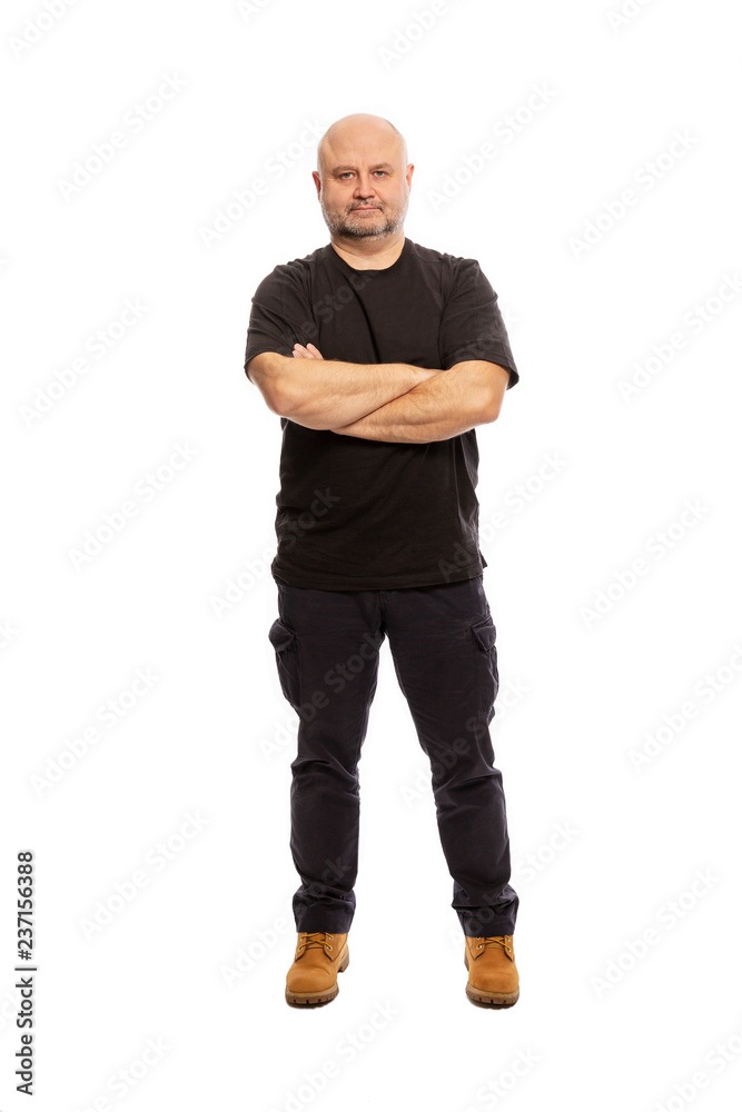 Adult bald man is standing, portrait on white background Adult bald man is standing, portrait on white background