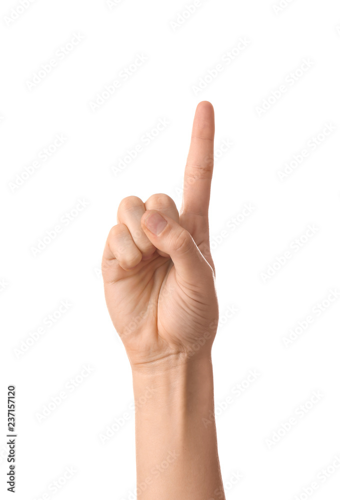 Female hand with raised index finger on white background Female hand with raised index finger on white background