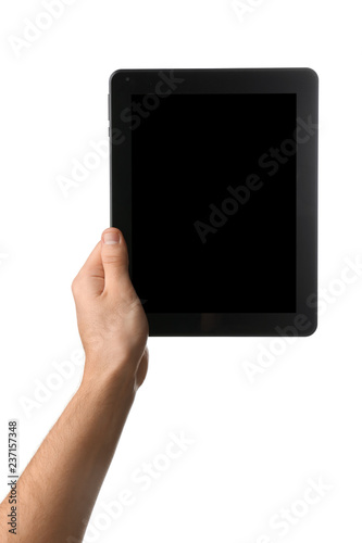 Young man holding tablet PC on white background