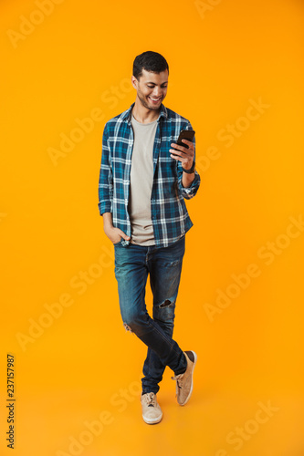 Full length portrait of a happy young man