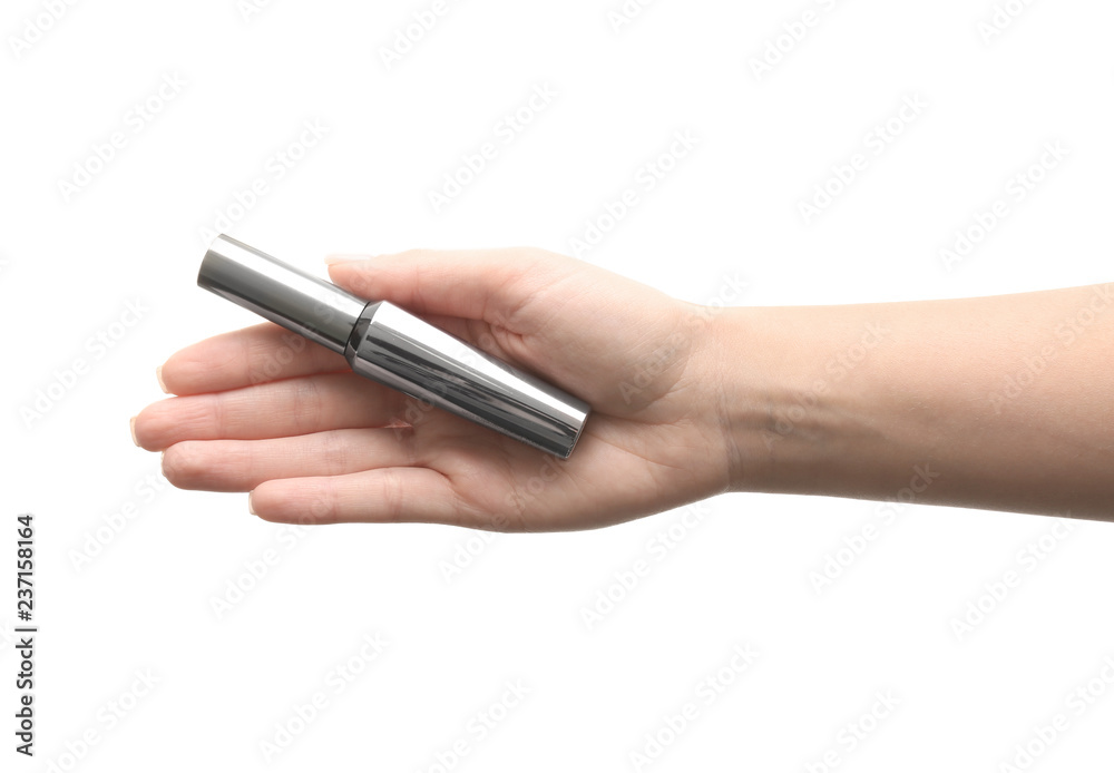 Woman holding mascara on white background Woman holding mascara on white background