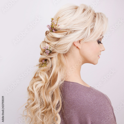 Portrait of an elegant young woman with blond hair. Trendy hairstyle