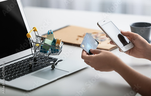 Woman shopping online with ...