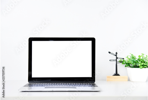 Working with Laptop computer,Hot coffee and plant copy space on desk background,business Concept
