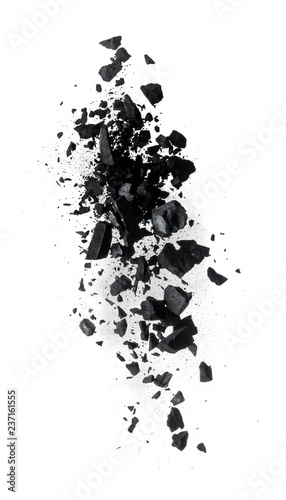 Activated charcoal powder splash or explosion flying in the air isolated on white background