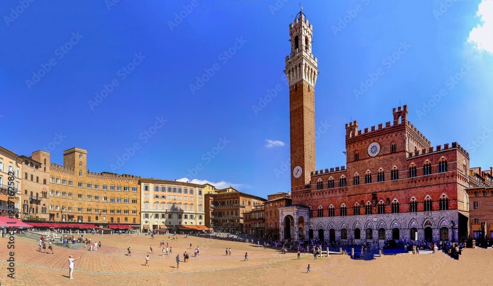 Panorama of the world famous Square Campo with the City Palace in Siena, Italy.