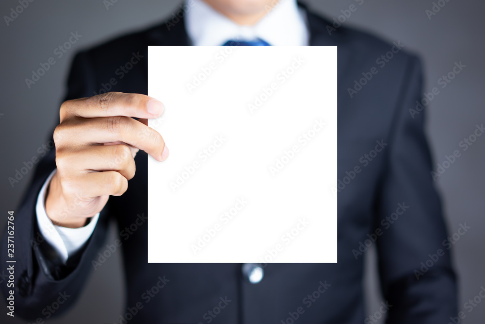 Businessman holding blank advertisement card with copy space Businessman holding blank advertisement card with copy space