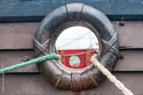 Ropes and hole in the side of the ship photo