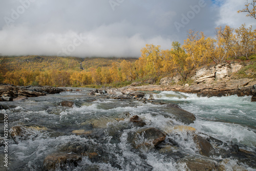 Autumn river landscape in a mountain landscape. Abisko national park in Sweden. © Conny Sjostrom