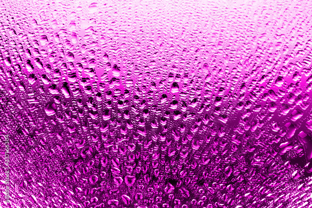 Glass surface in drops of water, bright pink color, shiny drops texture, wet background, light gradient, close up Glass surface in drops of water, bright pink color, shiny drops texture, wet background, light gradient, close up