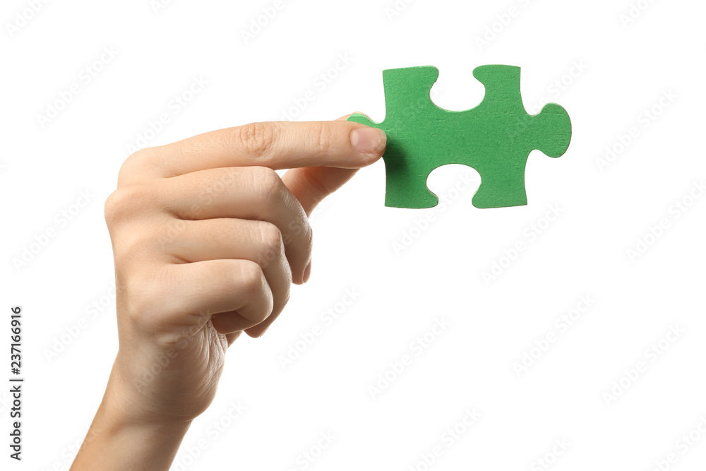 Woman with piece of color puzzle on white background Woman with piece of color puzzle on white background