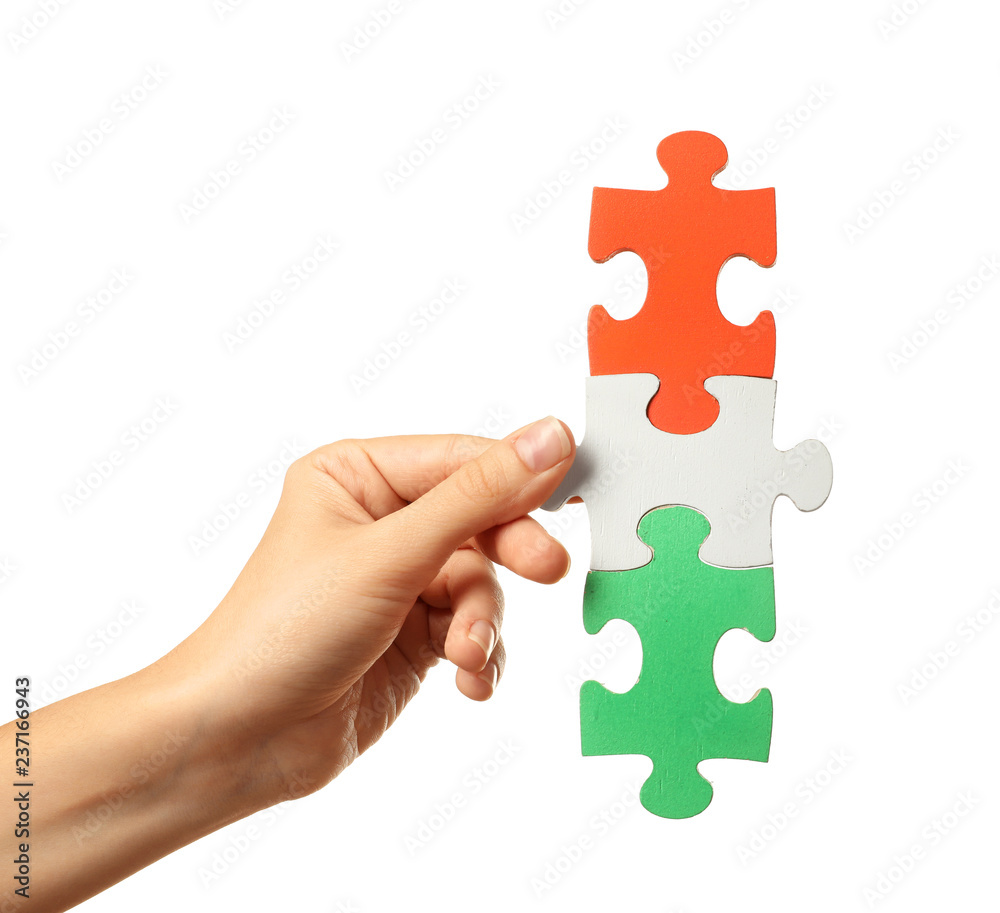 Woman with pieces of color puzzle on white background Woman with pieces of color puzzle on white background