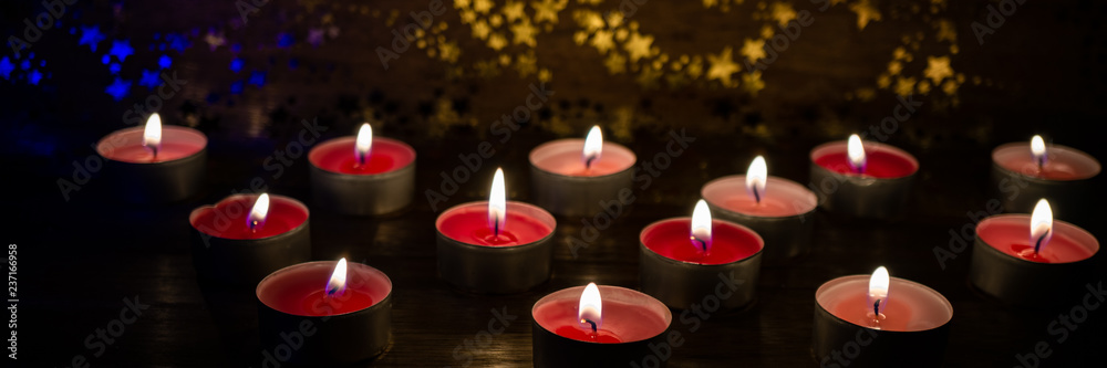 Many atmospheric tea lights, banner Many atmospheric tea lights, banner