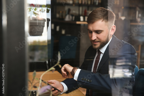Young businessman resting i...