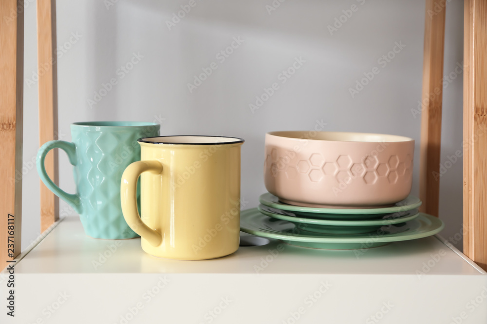 Set of clean tableware on shelf Set of clean tableware on shelf