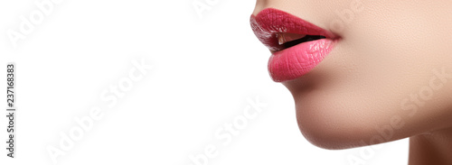 Fotografie, Obraz Close-up of woman's lips with bright fashion pink glossy makeup