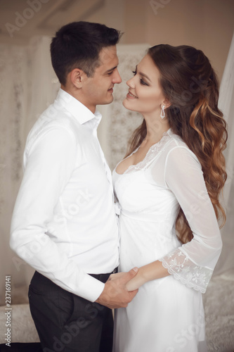 Happy newlywed couple wedding portrait. Beautiful bride and handsome groom in love. Romantic relationship.