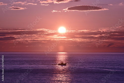                  A ship in sunrise time