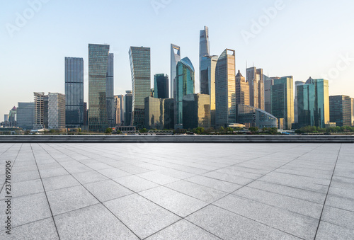 city skyline with empty square in urban