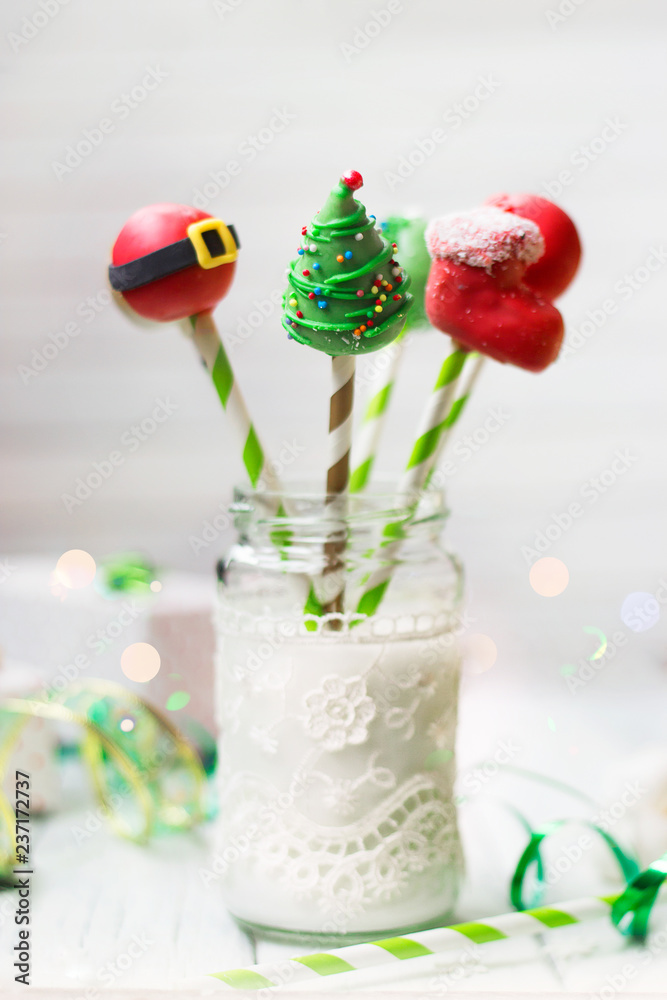 Christmas decorated cake pops; holiday background