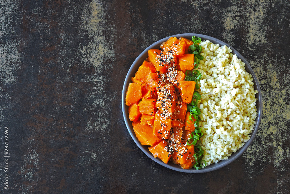 Buddha bowl with pumpkin and bulgur. Colorful, healthy foods Buddha bowl with pumpkin and bulgur. Colorful, healthy foods