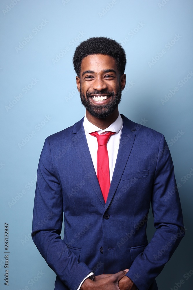 Beautiful black man in front of a colored background Beautiful black man in front of a colored background