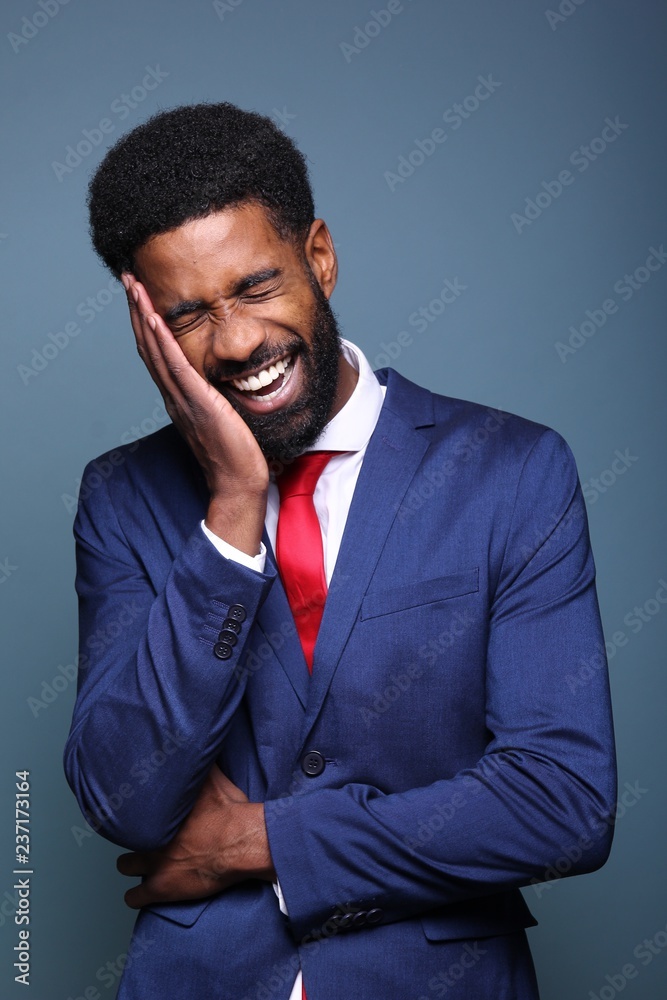Beautiful black man in front of a colored background Beautiful black man in front of a colored background
