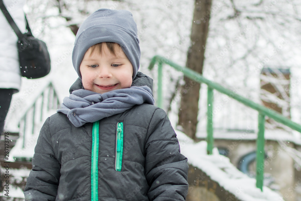 Little boy in winter outside.