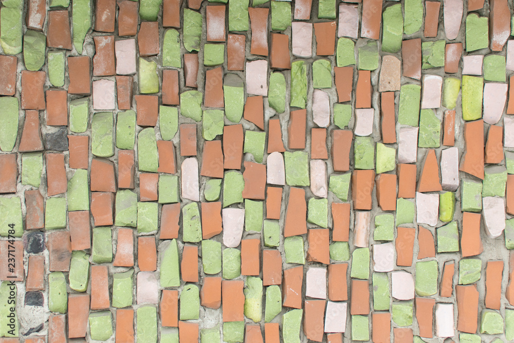 Fototapeta premium Background from a multi-colored mosaic on a wall.