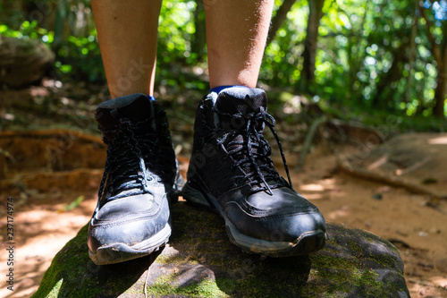 black hiking shoes walk to forest