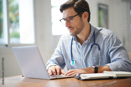  Handsome doctor in office