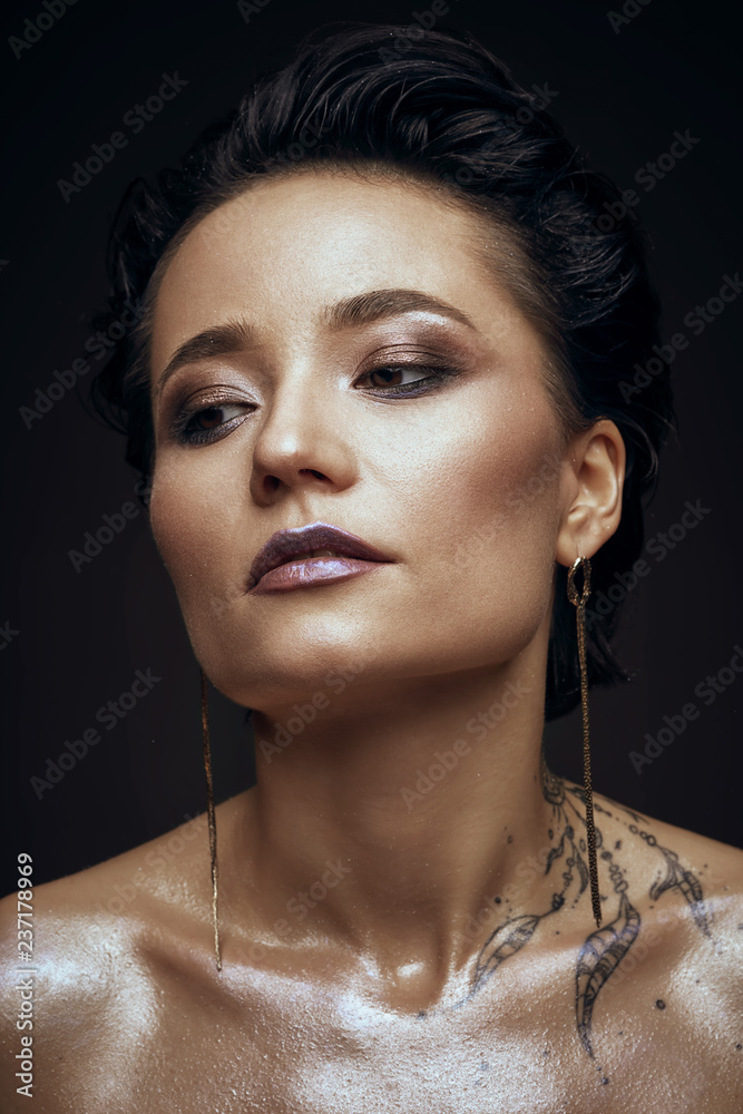 woman with tattoo beauty studio portrait 
