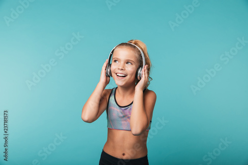 Happy little girl wearing sport clothing
