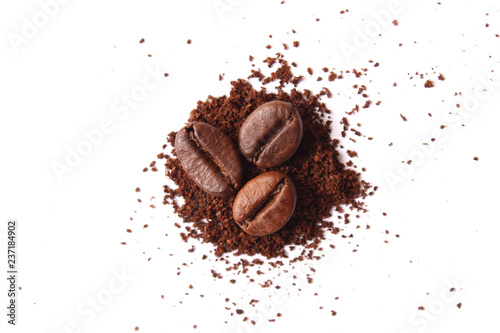 ground coffee and coffee beans isolated on white. Aromatic coffee, coffee drink