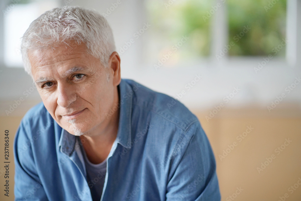 Portrait of senior man with white hair looking at camera Portrait of senior man with white hair looking at camera