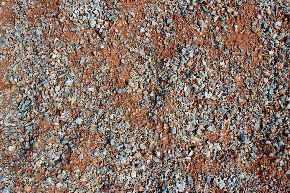 Gravel red dirt road surface texture close up Gravel red dirt road surface texture close up