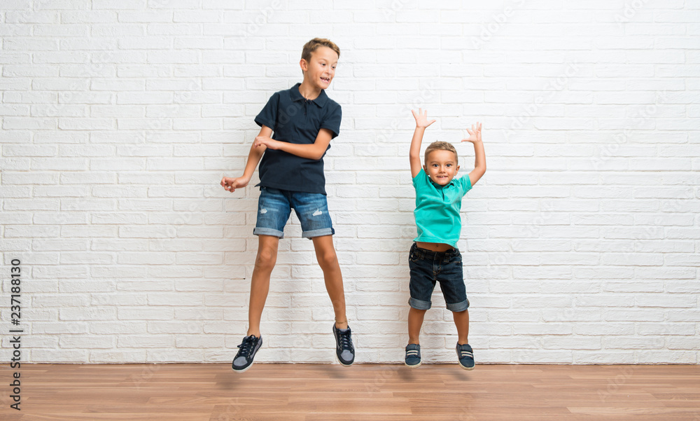 Two little brothers jumping