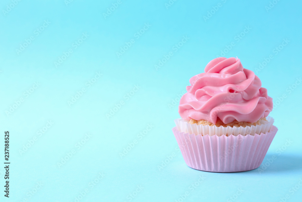 Tasty cupcake on color background Tasty cupcake on color background